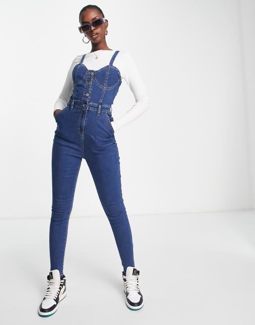Rebellious Fashion - Mellemblå denimjumpsuit med stropper foran