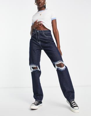 Rebellious Fashion mid wash denim distressed knee extra long jeans