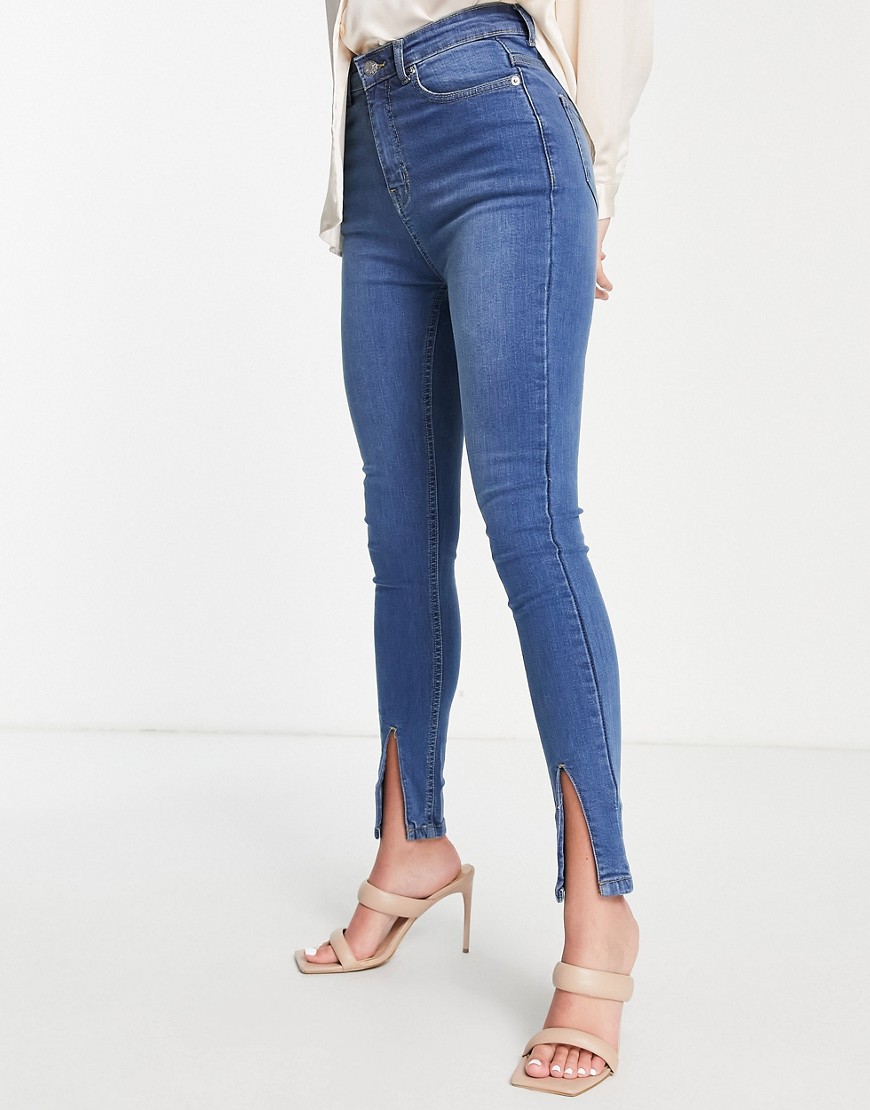 Rebellious Fashion split front skinny jeans in mid blue