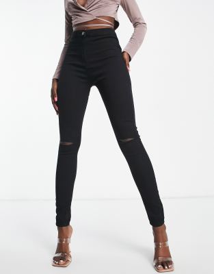 Rebellious Fashion - Stretch-Jeggings aus Denim in Schwarz mit Knierissen