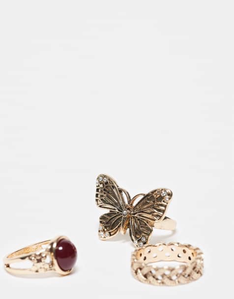 Reclaimed Vintage – 3er-Pack Ringe in Gold mit Schmetterling-Detail und rotem Kunststein - view 1