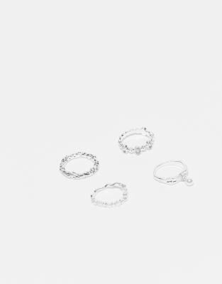 Reclaimed Vintage - 4er-Pack schmale Unisex-Ringe in geschmolzener Optik mit Schmucksteinen-Silber