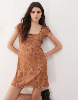 Reclaimed Vintage Reclaimed Vintage babydoll mesh mini dress with bow detail in paisley print - MULTI
