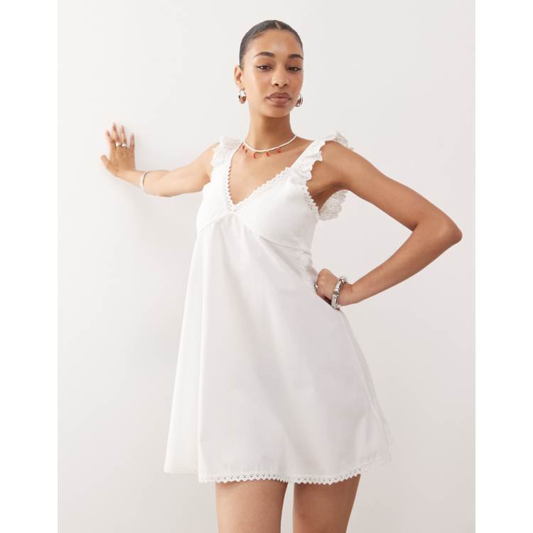 Reclaimed Vintage babydoll poplin cami mini dress with eyelet and lace  trims in cream | ASOS
