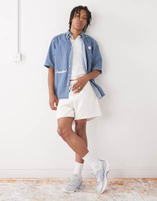 Reclaimed Vintage Reclaimed Vintage baggy fit shorter length pull on chino short in ecru-White