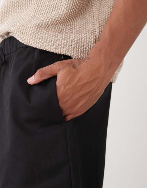 Reclaimed Vintage baggy fit shorter length pull on chino shorts in black