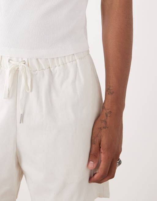 Reclaimed Vintage baggy fit shorter length pull on chino short in ecru
