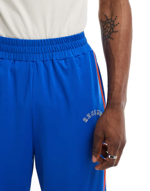 Adidas originals vintage joggers with taped side stripe in blue online