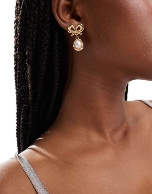 Reclaimed Vintage bow drop earrings with pearls in gold