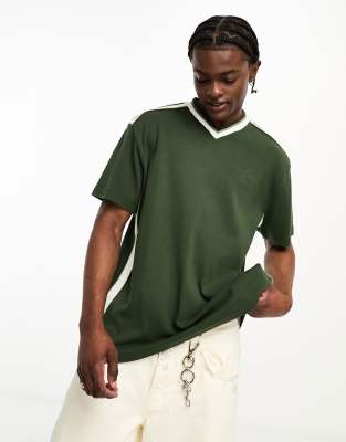 Reclaimed Vintage branded v-neck t-shirt in green | ASOS