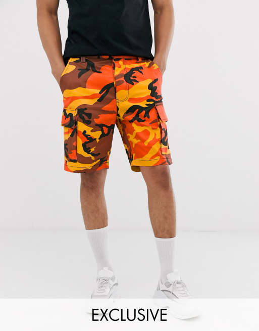 Reclaimed Vintage camo cargo shorts in orange | ASOS