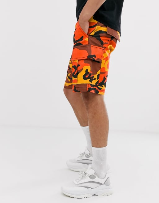 Reclaimed Vintage camo cargo shorts in orange