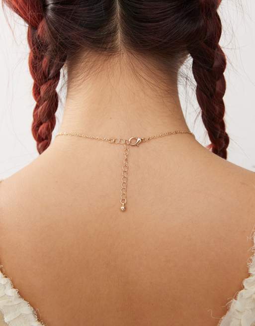 Reclaimed Vintage charm necklace with cross in gold ASOS