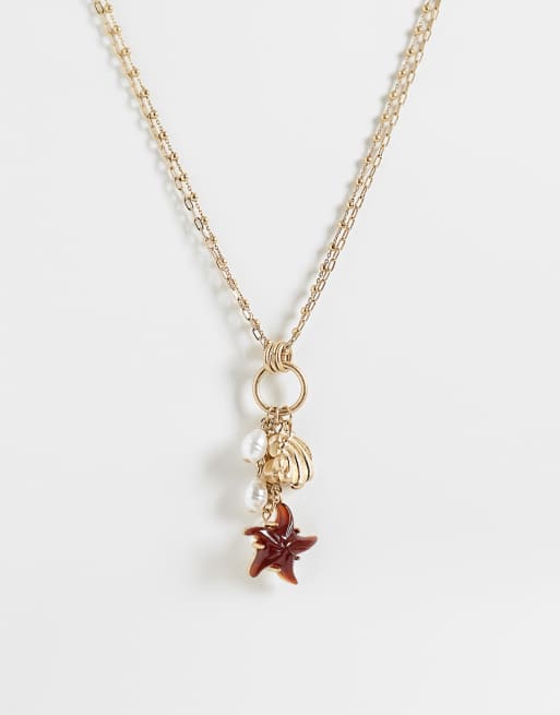 Reclaimed Vintage - Collana a catenina multifilo dorata con ciondolo a conchiglia