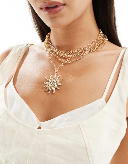 Reclaimed Vintage - Collier multirangs avec pendentif soleil - Doré