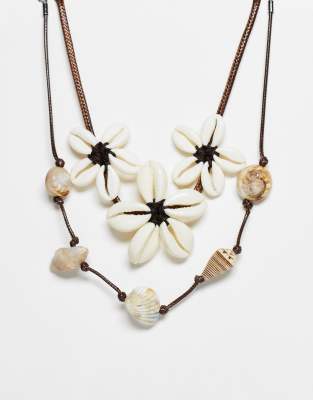 Reclaimed Vintage - Collier ras de cou multi-rangs unisexe avec fleurs en coquillages - Noir | ASOS