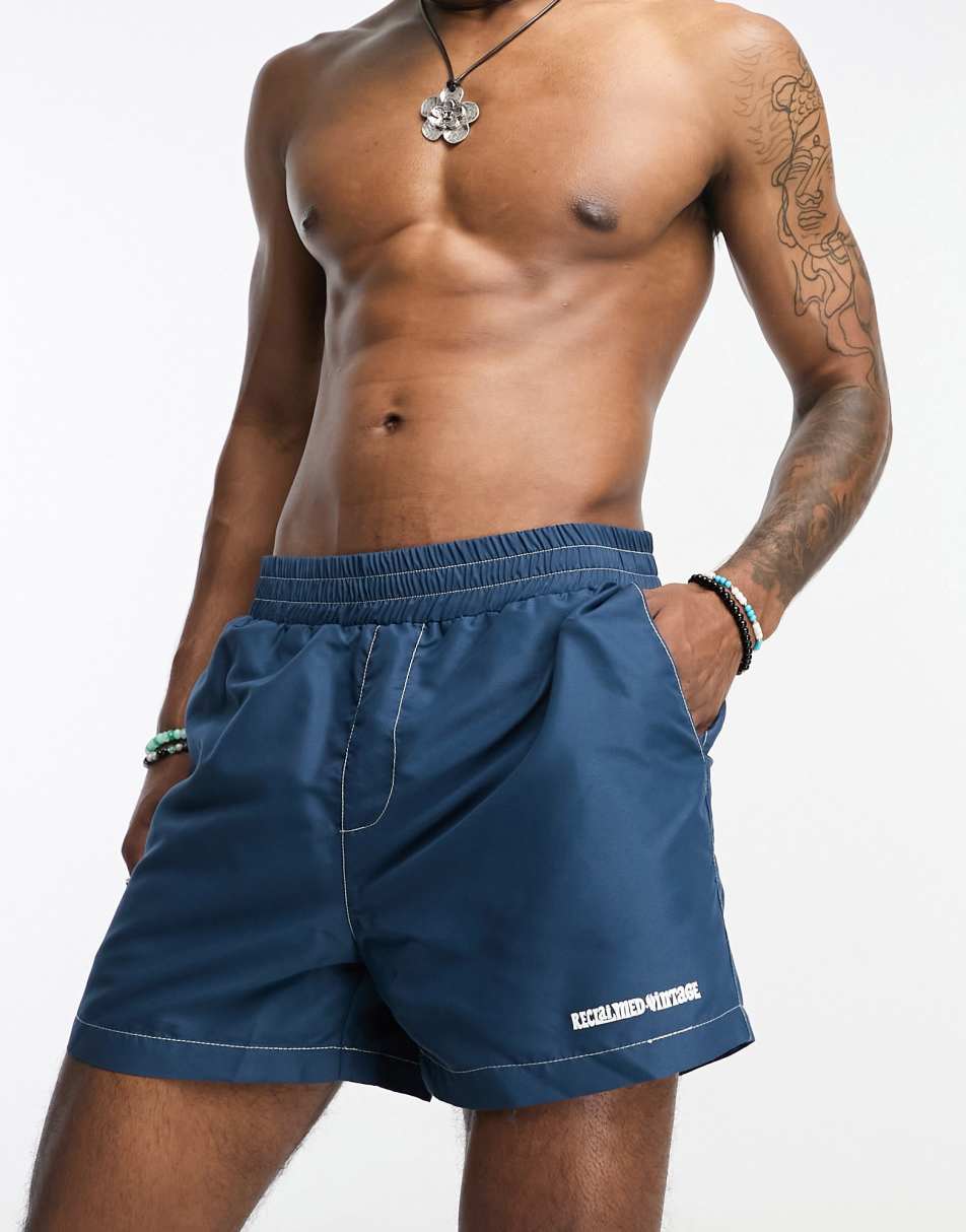 Reclaimed Vintage contrast stitch swim short in navy