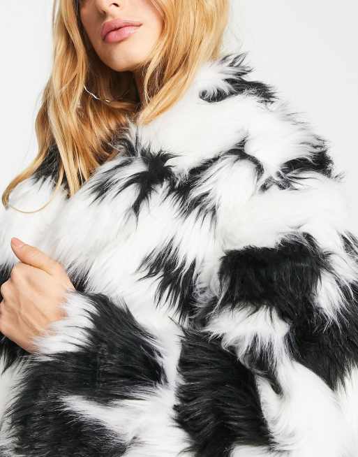 Reclaimed Vintage cow print faux fur coat in white