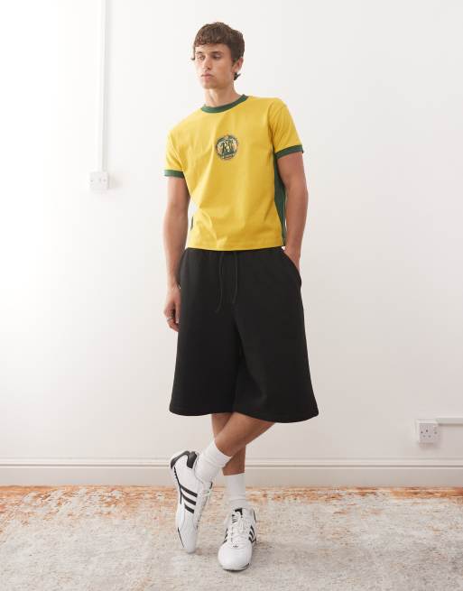 Reclaimed Vintage cropped boxy ringer t-shirt with beer mat graphic in yellow and green