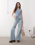 [Reclaimed Vintage] Reclaimed Vintage denim 70s palazzo jeans with patch pockets and button fly detail in blue wash W26 Blue Wash