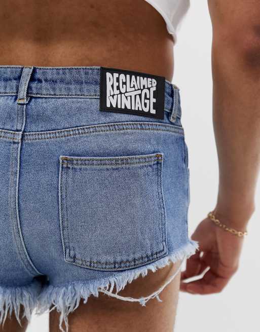 Reclaimed Vintage denim hot pants in mid wash blue