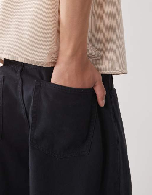 Reclaimed Vintage denim shin length baggy jorts in black | ASOS