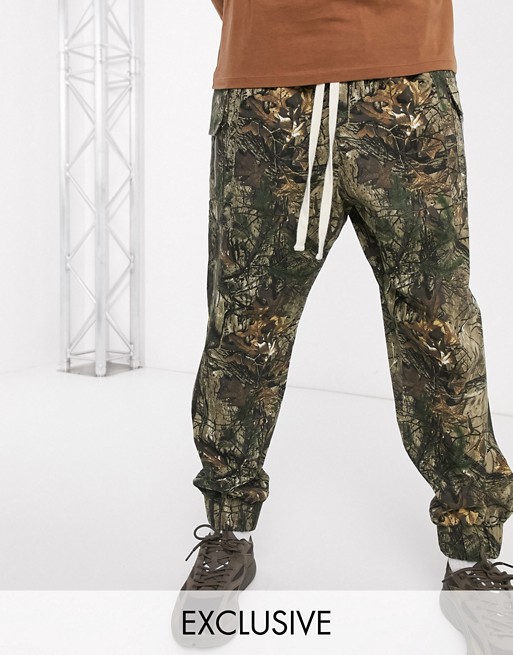 Reclaimed vintage drop crotch cargo with drawstring in camo