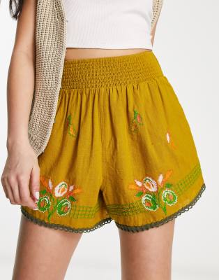 Reclaimed Vintage embroidered shorts in washed orange