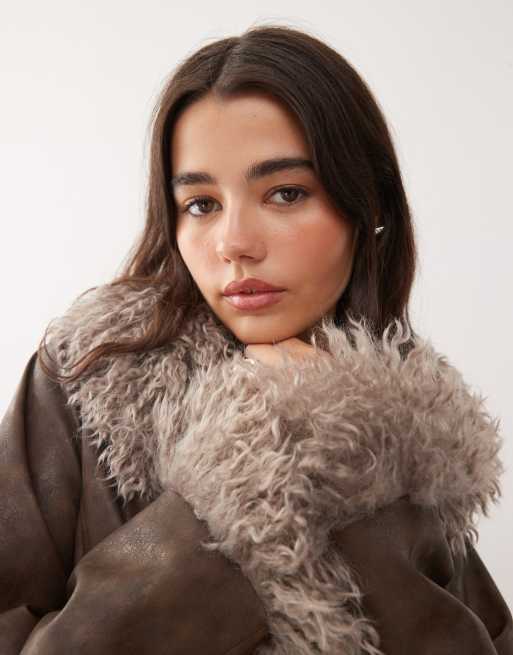 Reclaimed Vintage faux fur trim leather look short jacket in brown