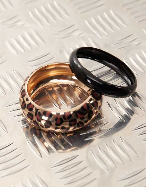 Reclaimed Vintage festival bangle 2 pack in black and gold leopard print