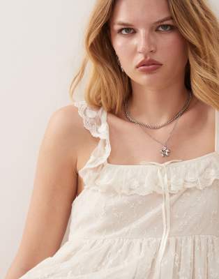 Reclaimed Vintage mini babydoll dress with lace inserts in white