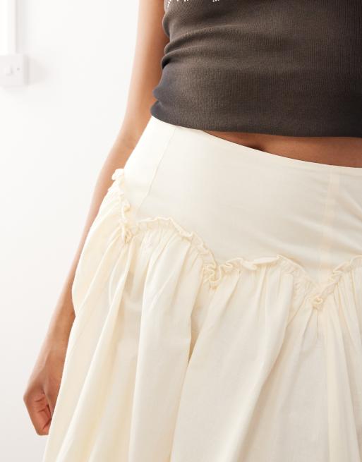 Reclaimed Vintage full midi skirt with dropped hem ruffle waist in cream