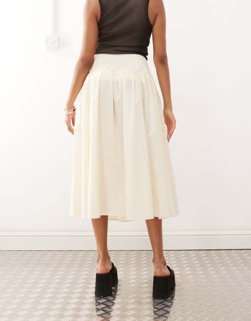 Reclaimed Vintage full midi skirt with dropped hem ruffle waist in cream