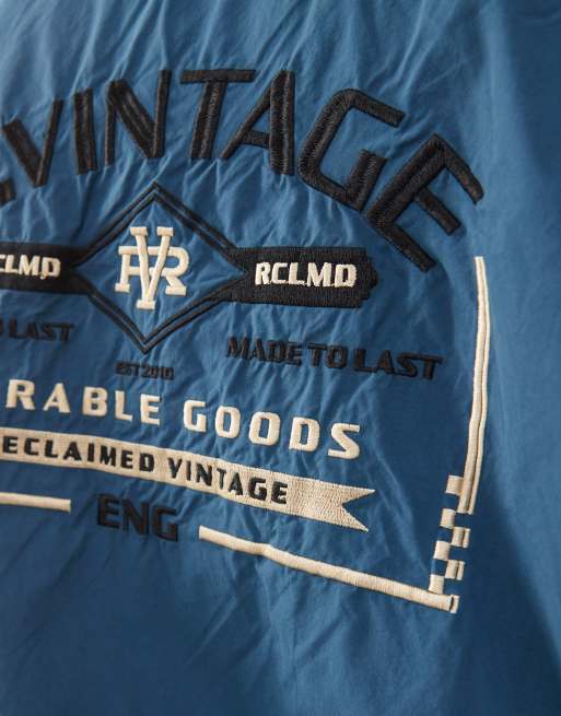 Reclaimed Vintage Harrington bomber jacket with back embroidery in ink blue