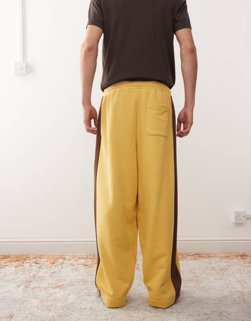 Reclaimed Vintage heavyweight wide leg jogger in mustard with brown side stripe