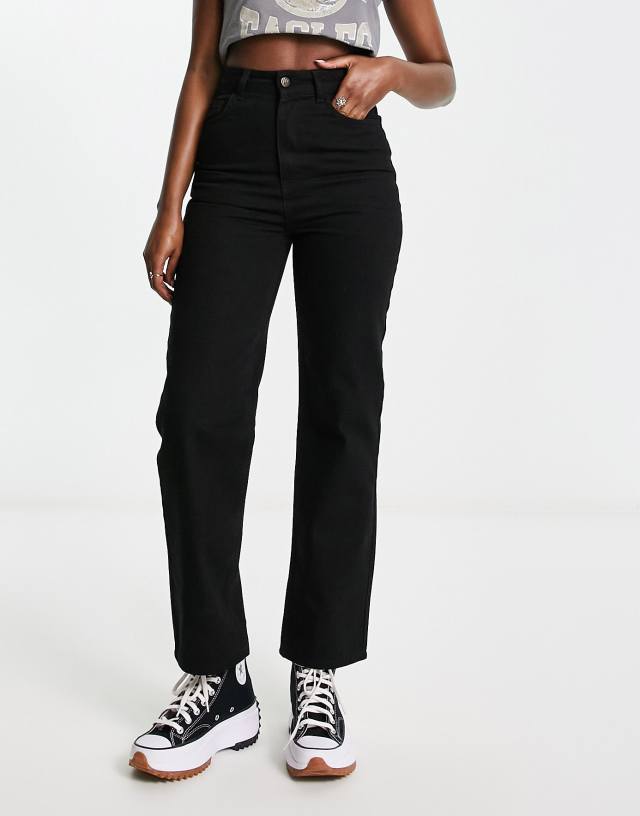 Reclaimed Vintage high rise slim leg jeans in washed black
