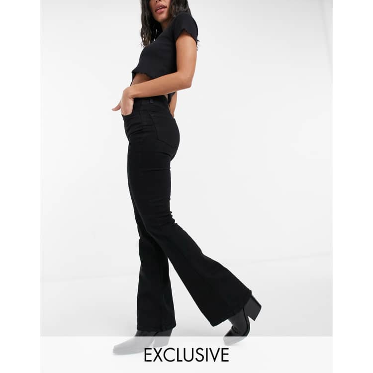 FfcoShops | fringed-trim track pants | Reclaimed Vintage inspired 79' super  stretch flare jean in clean black