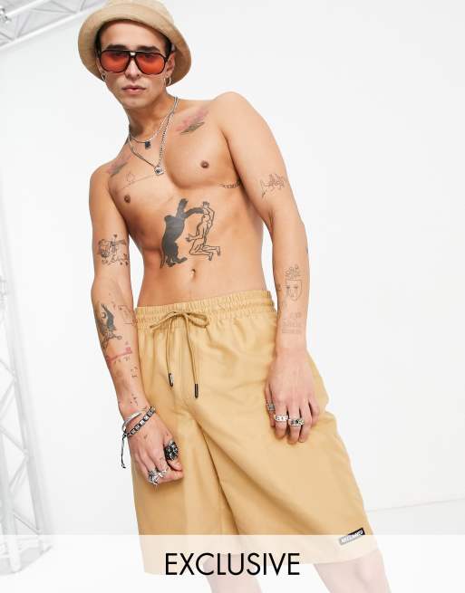 Reclaimed Vintage Inspired 90s baggy board swim shorts in beige