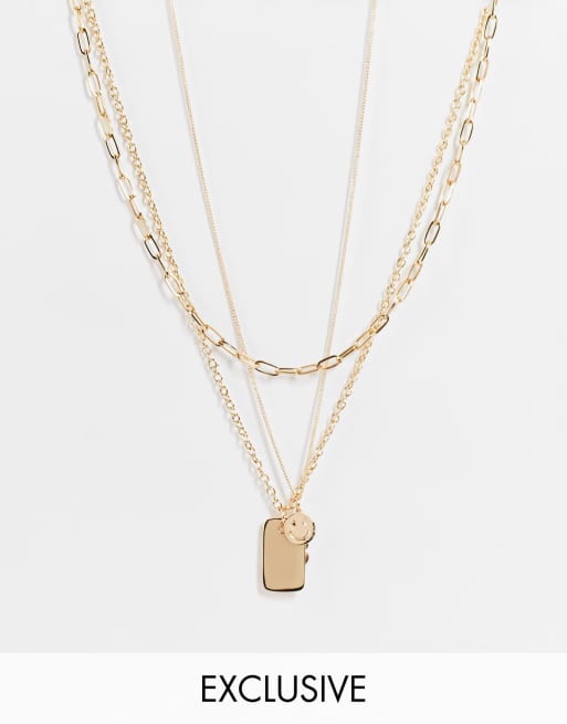 Reclaimed Vintage Inspired - Collier multirang avec pendentifs smiley et fleur avec signe de paix - Doré