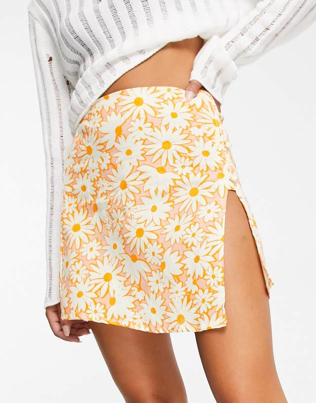 Reclaimed Vintage Inspired cross-over mini skirt in floral print