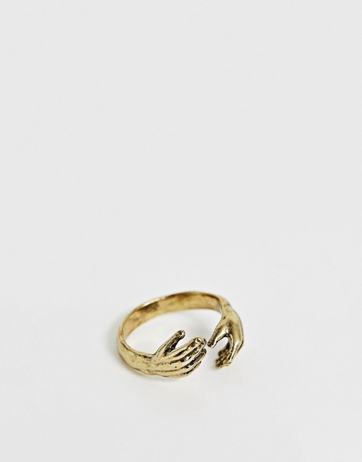Reclaimed Vintage inspired hands style ring in gold tone exclusive to ASOS
