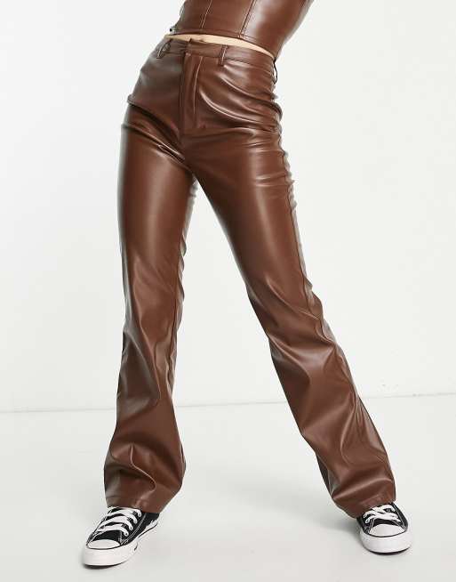 NA-KD faux leather low rise pants in brown