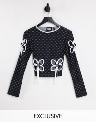 Reclaimed Vintage inspired long sleeve mesh top with cut out tie out detail in monogram print