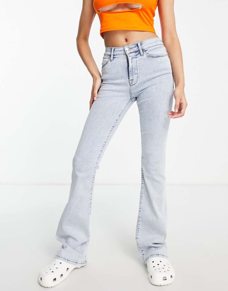 Reclaimed Vintage inspired low rise stretch flare in bleach wash