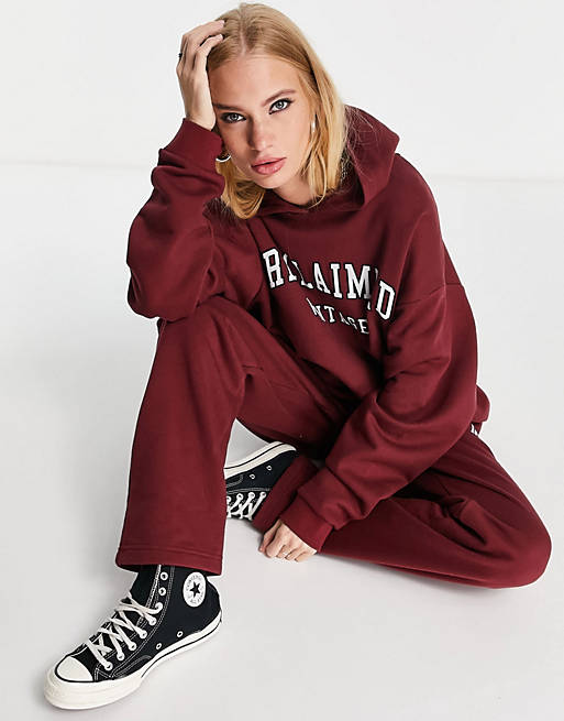 Women Reclaimed Vintage inspired organic cotton blend inclusive hoodie with varsity logo in burgundy co-ord 