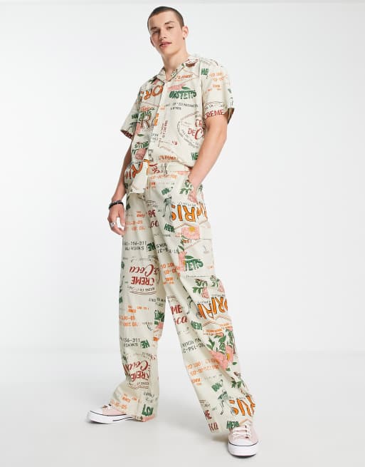 Reclaimed Vintage Inspired - Pantalon d'ensemble décontracté à imprimé voyage