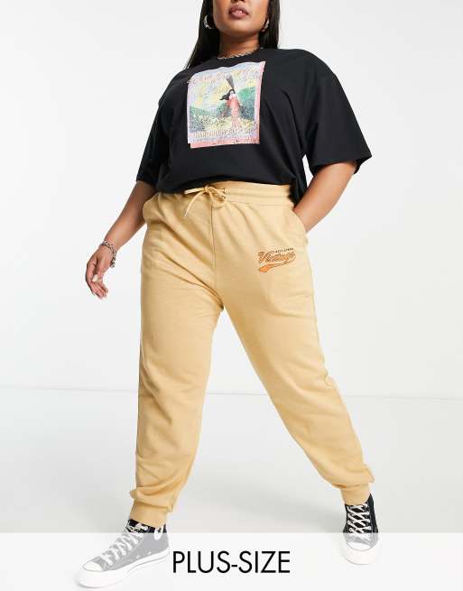 Reclaimed Vintage inspired plus varsity logo sweatpants in tan part of a set ASOS