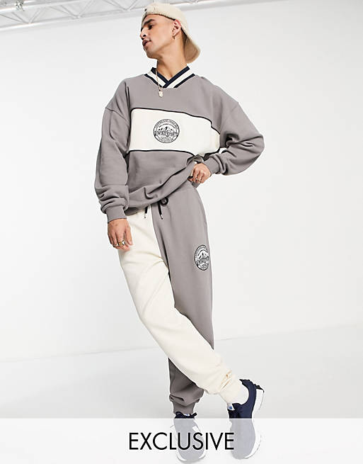 Tracksuits Reclaimed Vintage inspired relaxed joggers with mountain logo embroidery in colour block co-ord 