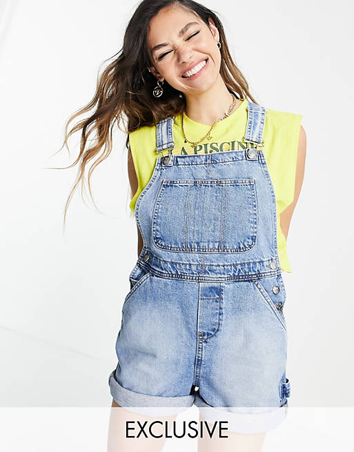 Women Reclaimed Vintage inspired short dungaree in mid blue wash 