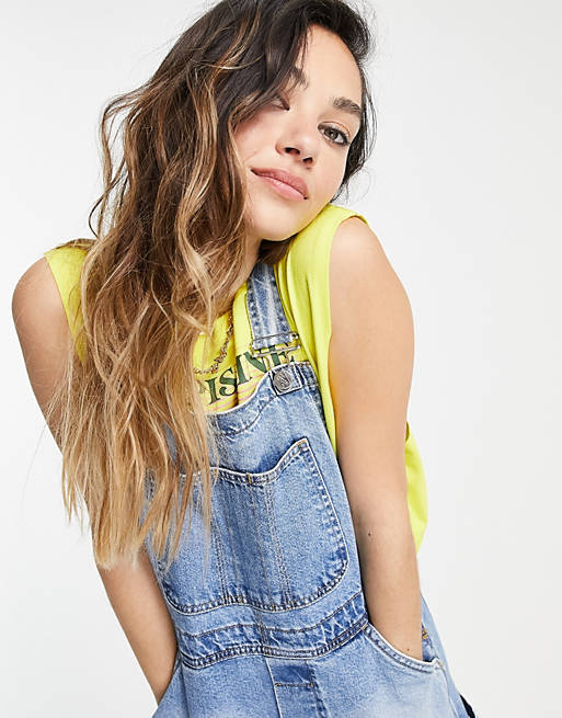 Women Reclaimed Vintage inspired short dungaree in mid blue wash 